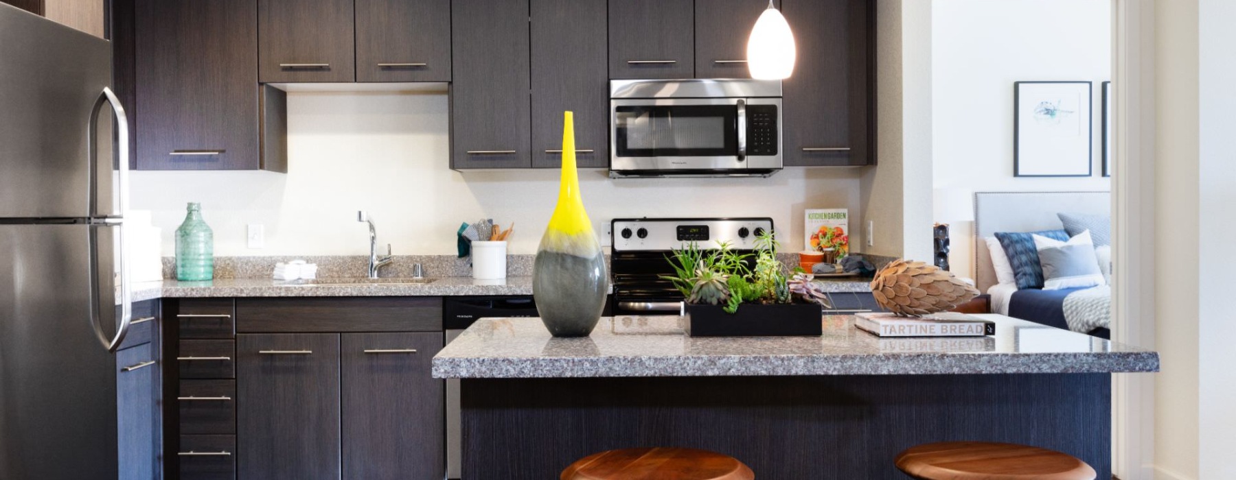 a kitchen with black cabinets